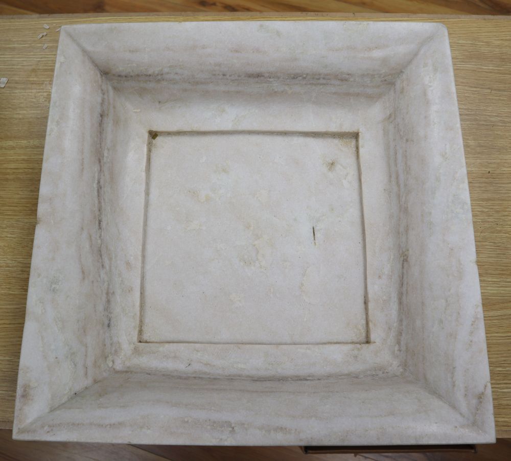 A square marble dish, 51cm sq.